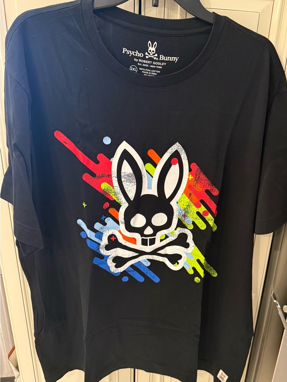 Psycho Bunny Black Tee with Multicolor Neon Splash Skull Bunny